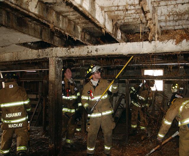 Josh aka &quot;flashlight&quot; and other members overhauling at barn fire 2/28/2010